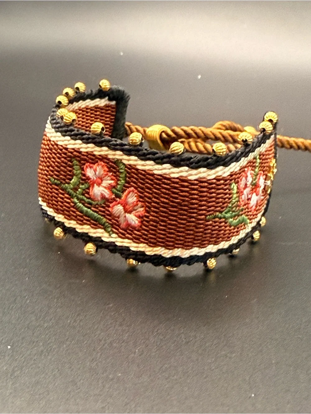 Tory Burch Rust Brown Embroidered Floral Rope Bracelet with Gold Logo